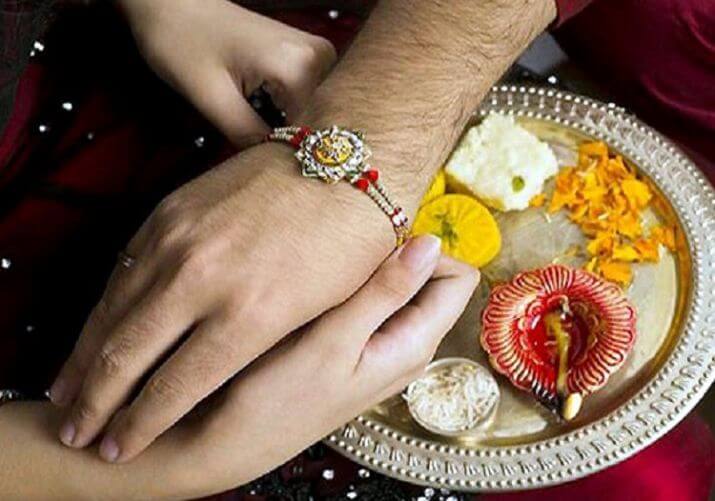 Sister Tying Rakhi to Brother's Hand - Raksha Bandhan Celebration